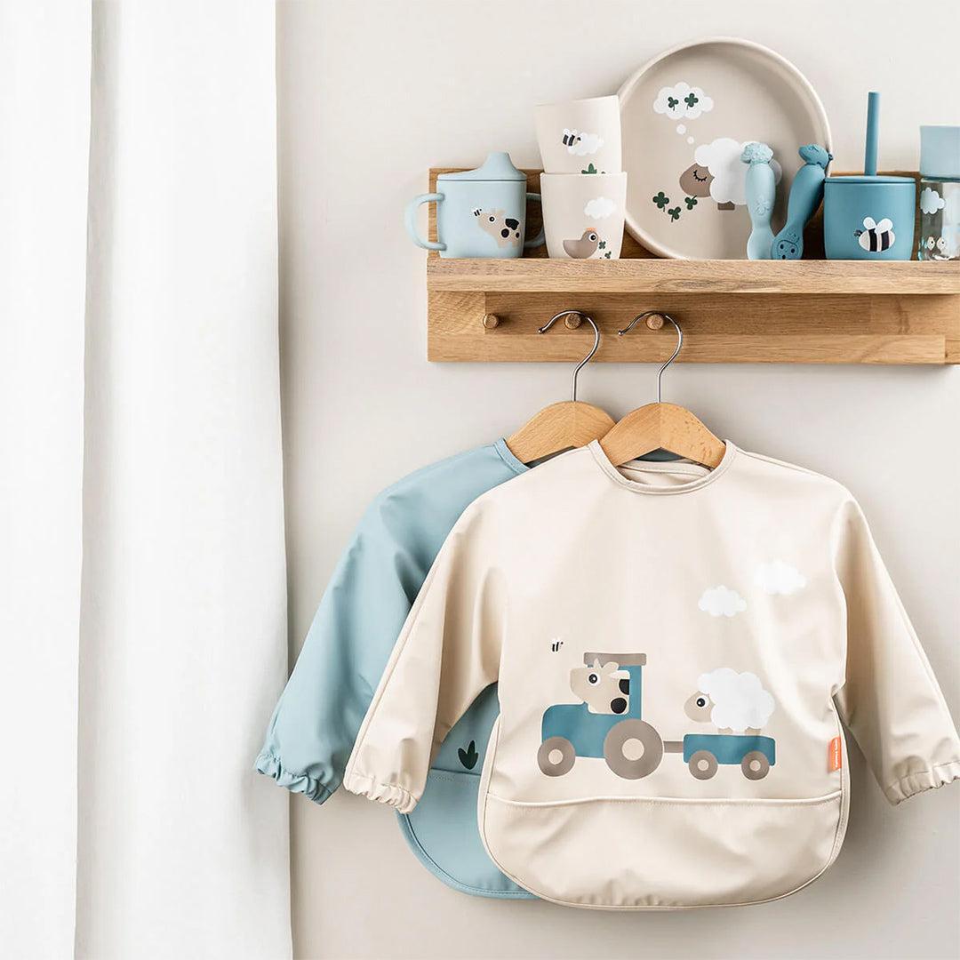 Done by Deer Sleeved Pocket Bib - Tiny Farm Sand
